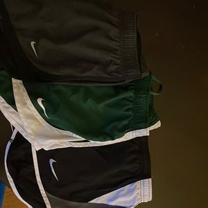 3 pairs of Nike- woman size small athletic shorts.